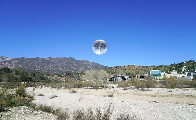 sphere over desert landscape